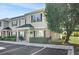 Charming two-story condo with black shutters and a tree-lined yard at 10970 Highway 90 # A5, Little River, SC 29566