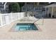 Community hot tub surrounded by brick pavers and lounge chairs at 10970 Highway 90 # A5, Little River, SC 29566
