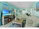 Comfortable living room with an electric fireplace, tv, and coastal-themed decor at 10970 Highway 90 # A5, Little River, SC 29566