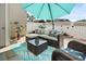 Cozy patio with comfortable seating, umbrella, and a privacy fence at 10970 Highway 90 # A5, Little River, SC 29566