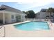Community pool with brick pavers, lounge chairs, and manicured landscaping at 10970 Highway 90 # A5, Little River, SC 29566