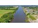 Gorgeous aerial view of a waterway community with a river winding through homes and docks on a sunny day at 1127 Crooked Hook Rd., North Myrtle Beach, SC 29582