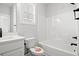 Well-lit bathroom featuring a shower-tub combo, toilet, sink and vanity with stylish modern fixtures at 1127 Crooked Hook Rd., North Myrtle Beach, SC 29582