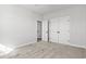 Carpeted bedroom features a closet with white doors and an open entry to another space at 1127 Crooked Hook Rd., North Myrtle Beach, SC 29582