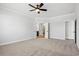 Spacious primary bedroom with carpet, featuring ensuite bathroom and walk-in closet at 1127 Crooked Hook Rd., North Myrtle Beach, SC 29582
