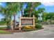 Welcome to Cherry Grove Park and Boat Ramp sign surrounded by vibrant flowers, lush greenery, and palm trees at 1127 Crooked Hook Rd., North Myrtle Beach, SC 29582