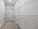 Walk-in closet with carpet flooring and wire shelving on three sides at 1127 Crooked Hook Rd., North Myrtle Beach, SC 29582