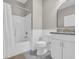 Clean bathroom with a tub/shower combination, toilet, and a vanity with a granite countertop at 1136 Doubloon Dr., North Myrtle Beach, SC 29582