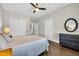 Bedroom with hardwood floors, closet, and dark dresser for storage at 1136 Doubloon Dr., North Myrtle Beach, SC 29582