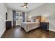 Comfortable bedroom with hardwood floors, ceiling fan, and window at 1136 Doubloon Dr., North Myrtle Beach, SC 29582