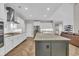 A large island with granite countertops is the focal point in this open concept modern kitchen at 1136 Doubloon Dr., North Myrtle Beach, SC 29582