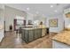 Open concept kitchen featuring a large island with granite countertops and stainless steel appliances at 1136 Doubloon Dr., North Myrtle Beach, SC 29582