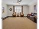 Cozy living room with comfortable seating, ceiling fan, and a window providing natural light at 1136 Doubloon Dr., North Myrtle Beach, SC 29582