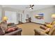 Open living room showcasing natural light, comfortable seating, and a ceiling fan at 1136 Doubloon Dr., North Myrtle Beach, SC 29582