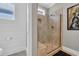 Modern shower with glass door, tile walls, and tiled shower floor, complemented by white shiplap wall paneling at 1136 Doubloon Dr., North Myrtle Beach, SC 29582