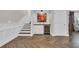 Stairway with a built-in wine refrigerator, creating an entertainment space, and a decorative wall art at 1136 Doubloon Dr., North Myrtle Beach, SC 29582