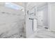 Bathroom featuring a large shower, a glass door, and marble tile at 1196 Fiddlehead Way, Myrtle Beach, SC 29579