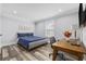 Bedroom featuring a desk, a blue bed, and hardwood floors at 1196 Fiddlehead Way, Myrtle Beach, SC 29579