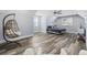 Bedroom featuring a hanging chair, bed, fan and hardwood floors at 1196 Fiddlehead Way, Myrtle Beach, SC 29579