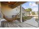 Relaxing front porch featuring a hammock and tranquil view at 1196 Fiddlehead Way, Myrtle Beach, SC 29579