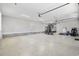 Spacious garage with epoxy floor, ample storage, and gym equipment at 1196 Fiddlehead Way, Myrtle Beach, SC 29579