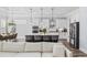 Open kitchen and dining area featuring a large island, modern appliances, and stylish pendant lighting at 1196 Fiddlehead Way, Myrtle Beach, SC 29579