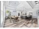 Spacious open layout features a modern kitchen with island and a dining area with natural light at 1196 Fiddlehead Way, Myrtle Beach, SC 29579
