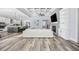 Open-concept living space with kitchen, living, and dining areas, showcasing coffered ceilings and modern finishes at 1196 Fiddlehead Way, Myrtle Beach, SC 29579