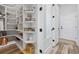 Walk-in pantry featuring custom shelving, storage containers, and easy access to kitchen essentials at 1196 Fiddlehead Way, Myrtle Beach, SC 29579