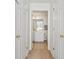 Bathroom entrance with double doors offering a view of a vanity and commode at 138 Butkus Dr. # 2, Myrtle Beach, SC 29588
