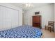 Bedroom featuring a bed with blue pattern, dresser, closet, ceiling fan, and chair at 138 Butkus Dr. # 2, Myrtle Beach, SC 29588
