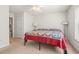 Bright bedroom featuring a large bed, neutral carpet, and natural light from a window at 138 Butkus Dr. # 2, Myrtle Beach, SC 29588