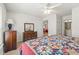Bedroom featuring a bed with quilt, dresser, and open doorway to bathroom at 138 Butkus Dr. # 2, Myrtle Beach, SC 29588