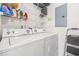 Efficient laundry room with washer, dryer, and ample shelving for storage at 138 Butkus Dr. # 2, Myrtle Beach, SC 29588