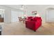 Bright living room with ceiling fan, neutral carpet, and red sofas at 138 Butkus Dr. # 2, Myrtle Beach, SC 29588