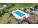 Community pool surrounded by lounge chairs and palm trees, perfect for relaxing and enjoying the outdoors at 138 Butkus Dr. # 2, Myrtle Beach, SC 29588