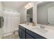 Bathroom features double sink vanity, decorative mirrors, and shower/tub combo with a white curtain at 141 Ranch Haven Dr., Murrells Inlet, SC 29576