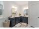 Bathroom with double vanity, shaker cabinets, and neutral countertops at 141 Ranch Haven Dr., Murrells Inlet, SC 29576
