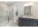Bathroom with walk-in shower, shaker cabinets, and neutral countertops at 141 Ranch Haven Dr., Murrells Inlet, SC 29576