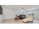 Entertainment room with reclining chairs, a ceiling fan, and large windows for natural light at 141 Ranch Haven Dr., Murrells Inlet, SC 29576