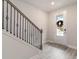 Bright entryway with elegant staircase and modern light wood flooring at 141 Ranch Haven Dr., Murrells Inlet, SC 29576