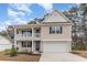 Charming two-story home with a welcoming front porch and attached two-car garage at 141 Ranch Haven Dr., Murrells Inlet, SC 29576