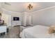 Bright main bedroom with a decorative light fixture and ensuite access at 141 Ranch Haven Dr., Murrells Inlet, SC 29576