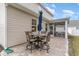Charming patio with umbrella table and chairs for outdoor dining with access to screened porch at 141 Ranch Haven Dr., Murrells Inlet, SC 29576