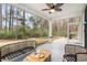 Serene screened-in porch with stylish seating, ideal for enjoying the outdoors with added comfort at 141 Ranch Haven Dr., Murrells Inlet, SC 29576
