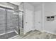 Bathroom showcasing a tiled walk-in shower with a built-in seat and decorative tile flooring at 1463 Villena Dr., Myrtle Beach, SC 29579