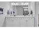 Bright bathroom featuring double sinks with stylish fixtures and finishes, and a walk-in shower in view at 1463 Villena Dr., Myrtle Beach, SC 29579