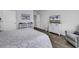 Cozy bedroom with luxury vinyl plank flooring, gray walls, and white furnishings at 1463 Villena Dr., Myrtle Beach, SC 29579