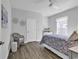 Comfortable bedroom with luxury vinyl plank flooring and a ceiling fan at 1463 Villena Dr., Myrtle Beach, SC 29579