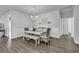Bright dining area with hardwood floors, white wainscotting, and a modern chandelier at 1463 Villena Dr., Myrtle Beach, SC 29579